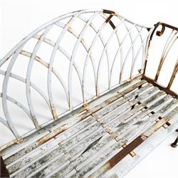 Small wrought metal two seat garden bench, finished in distressed white paint