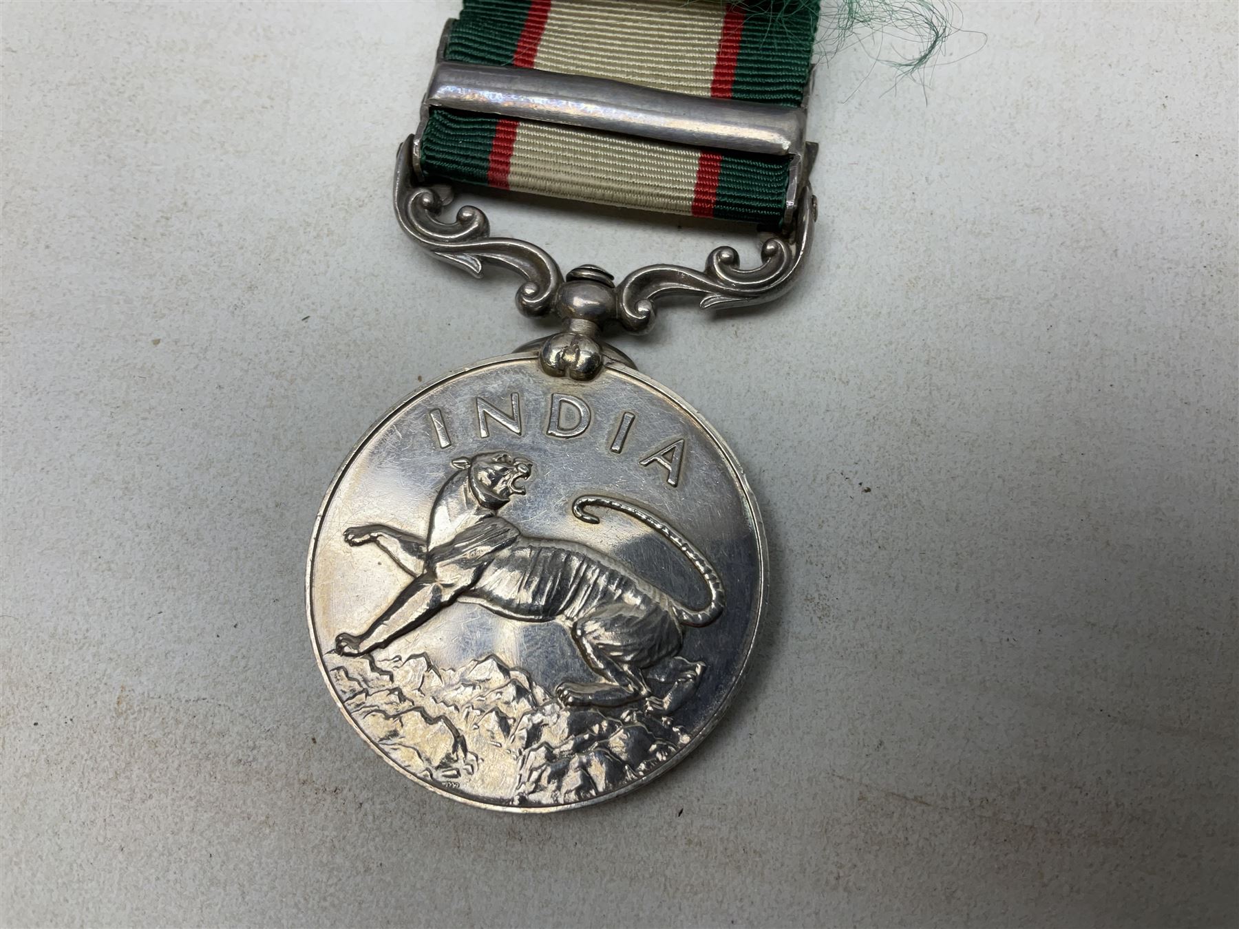 George VI India General Service Medal with North West Frontier 1936-37 clasp awarded to Bearer Khan Akbar 2-Border R.; with ribbon