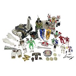 Collection of early 90s Mighty Morphin’ Power Rangers Zords, figures and accessories. Titanus the Carrier Zord, marked Bandai 1991; Green Dragonzord, incomplete; 1994 White Tigerzord with original instruction manual; 1993 Triceratops Dinozord, Mastodon Dinozord and Sabertooth Tiger Dinozord, Pterodactyl Dinozord, missing guns; with 1993 Power Morpher and original Power Coins, with further related figures, accessories and weapons
