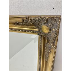Large bevel edge wall mirror in traditional gilt frame, floral and cock beaded moulding 