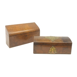 A Victorian walnut correspondence box, the sloping hinged cover opening to reveal a compartmented interior, L27cm, together with a further Victorian walnut box, with scrolling brass mount to the slightly domed cover, and conforming brass escutcheon, L25cm. 
