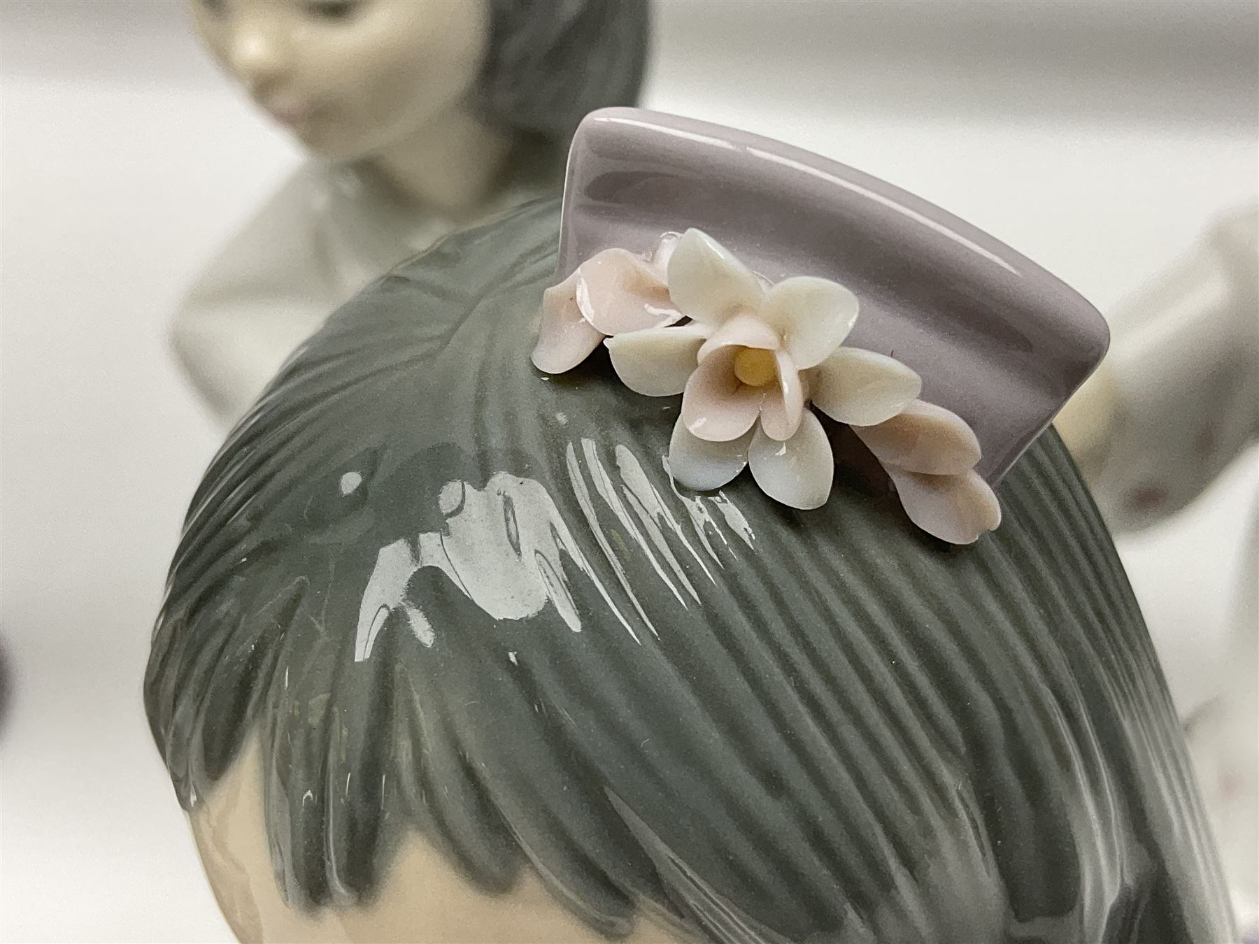 Six Lladro figures of the China doll set and Oriental doll set, comprising Playing the Flute no.6150, Bearing Flowers no.6151, Flower Gazer no. 6152, Oriental Dance no. 6230, Oriental Lantern no. 6231 and Oriental Beauty no. 6232, largest H20cm