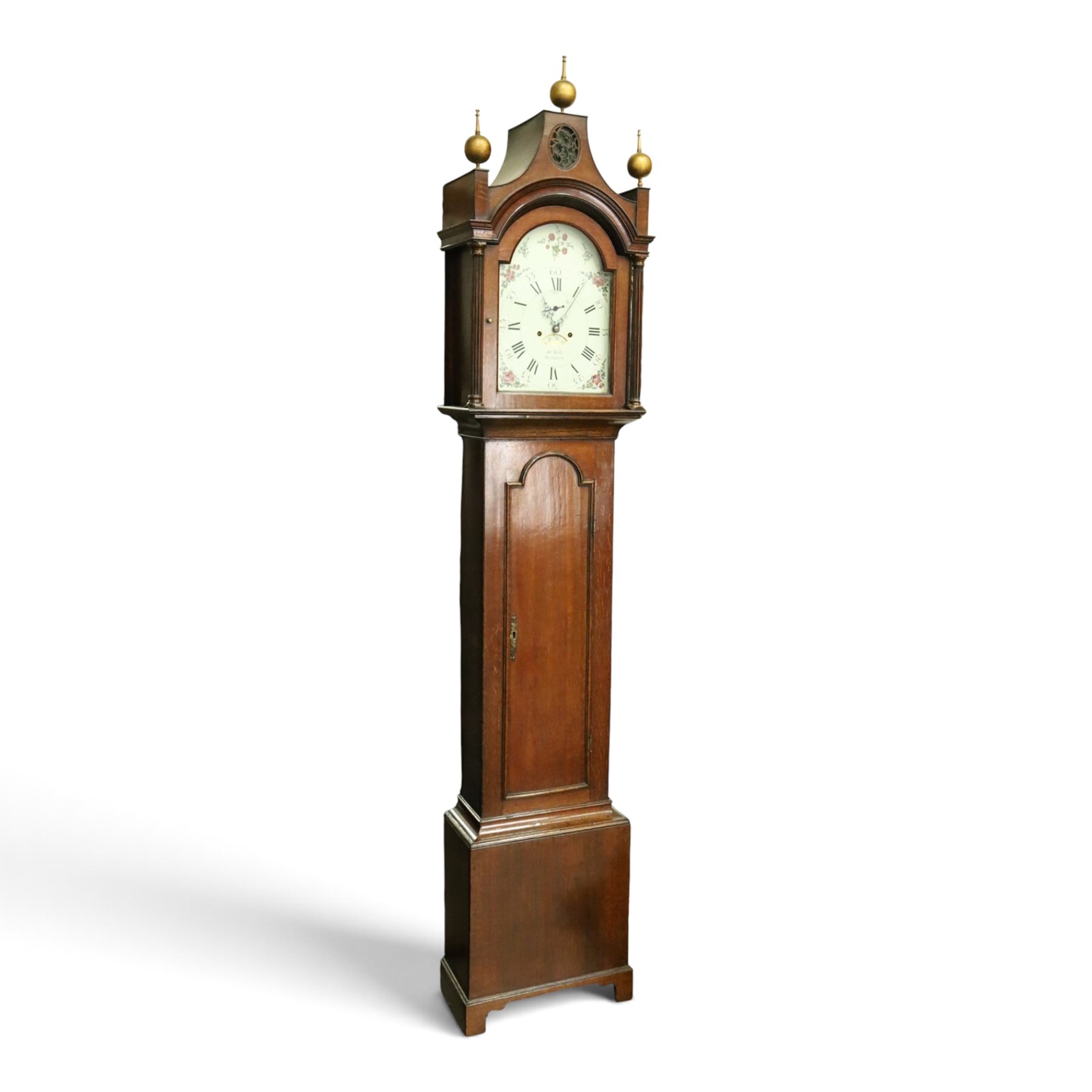 John Hall of Beverley - George III oak eight-day longcase clock, the painted arched dial with subsidiary seconds and date aperture, floral decoration, the case with pagoda top, pierced fretwork panel, brass ball finials, fluted pilasters and arched trunk door