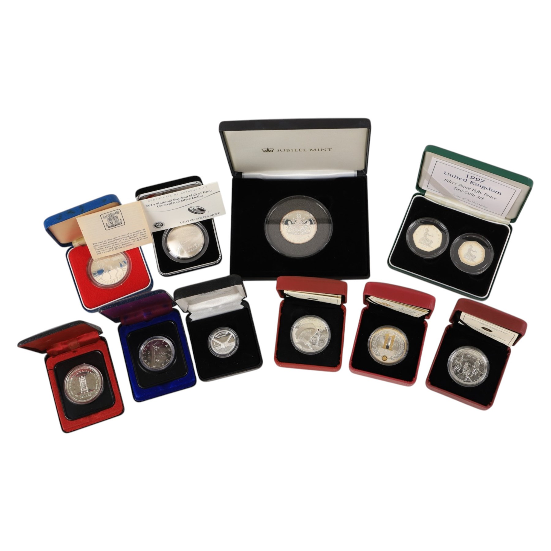 Nine world silver coins or sets, including The Royal Mint United Kingdom 1977 silver proof fifty pence two coin set, 1977 'Silver Jubilee' silver proof crown, USA 2014 'National Baseball Hall of Fame' silver dollar, Australia 2007 '75th Anniversary of the Sydney Harbour Bridge' one dollar fine silver coin, etc, together with a Canada 1975 one dollar, mostly cased with certificates