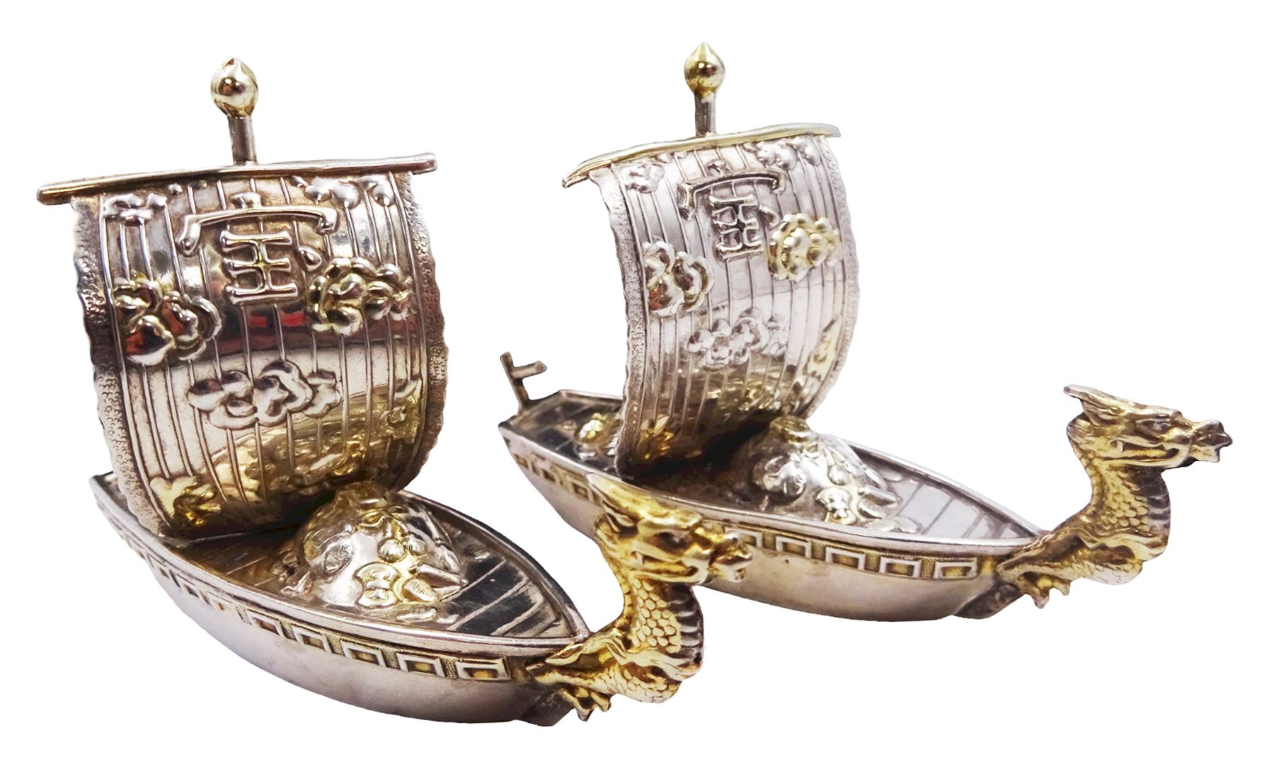 Pair of 20th century Japanese silver novelty cruets, modelled in the form of Viking long ships, marked Sterling Japan, contained within a fitted case, approximate silver weight 1.18 ozt (36.6 grams)