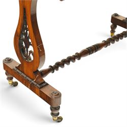 Victorian walnut marquetry and parquetry centre table, the rectangular top with floral marquetry and geometric lattice parquetry with ebonised moulded edge, raised on lyre-shaped end supports with pierced floral scrollwork, united by a spiral-turned stretcher, on brass castors