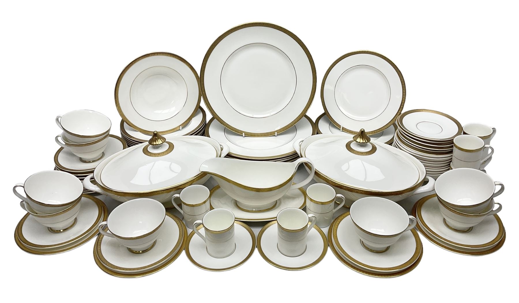 Royal Doulton Royal Gold pattern tea and dinner service for eight, comprising dinner plates, side plates, tea plates, soup bowls, sauce boat and saucer, dessert bowls, coffee cans and saucers, teacups and saucers and two lidded tureens
