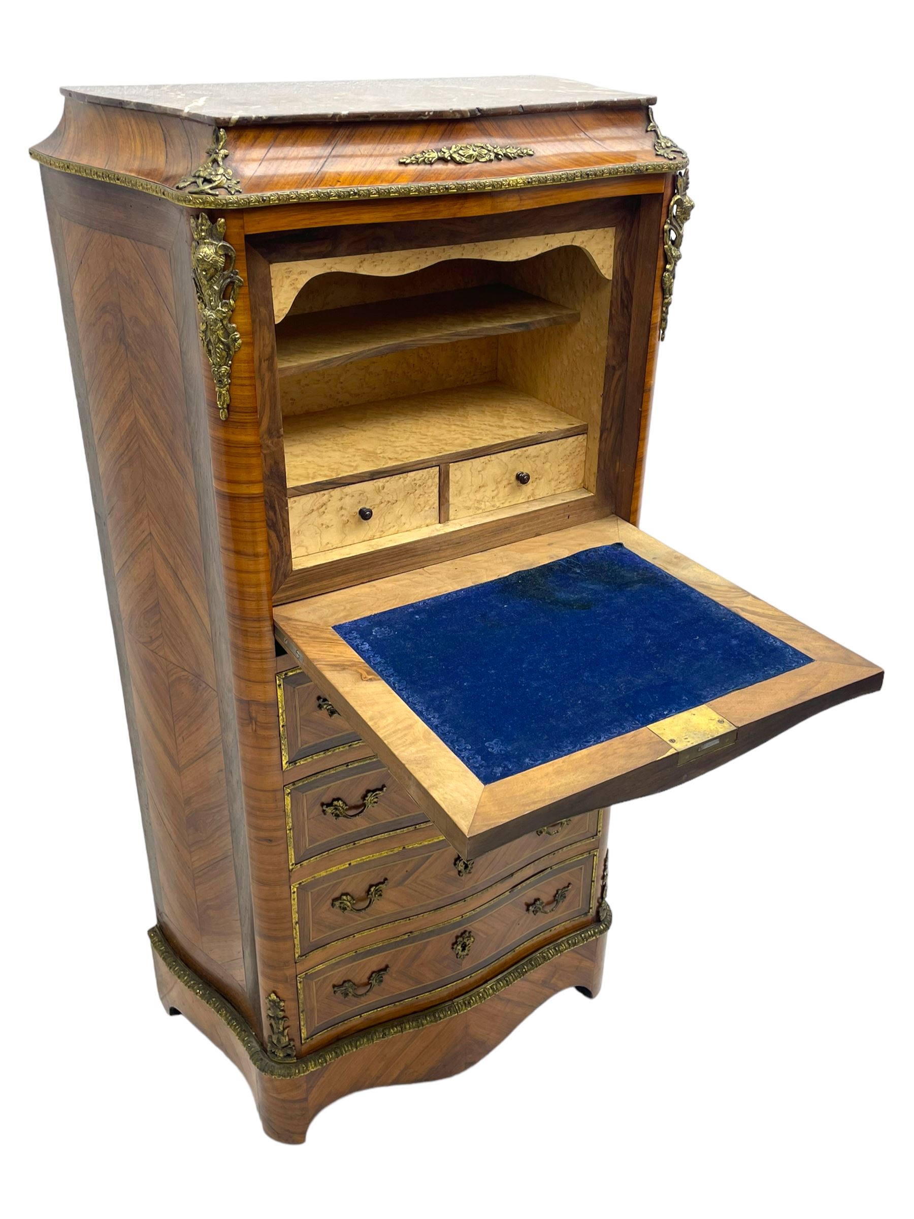 Mid-20th century Louis XVI design Kingwood and walnut secretaire à Abattant, shaped serpentine form with dark rouge variegated marble top, the fall front disguised as three drawers enclosing birdseye maple interior with shelf, drawers and writing surface, four functioning drawers below, decorated with cast gilt metal mouldings and mask cartouches, on skirted base with egg and dart moulded gilt metal edge