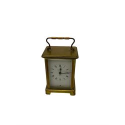 A French carriage clock by Duverdrey & Bloquel c1920, with three glass panels and white enamel dial, Roman numerals and minute markers, lever platform escapement and integral winding key. Together with a late 19th century American spring driven 30hr alarm clock by Seth Thomas of Connecticut USA c1890, in a wooden case with a white dial and brass alarm setting disc.   


