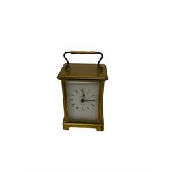 A French carriage clock by Duverdrey & Bloquel c1920, with three glass panels and white enamel dial, Roman numerals and minute markers, lever platform escapement and integral winding key. Together with a late 19th century American spring driven 30hr alarm clock by Seth Thomas of Connecticut USA c1890, in a wooden case with a white dial and brass alarm setting disc.   


