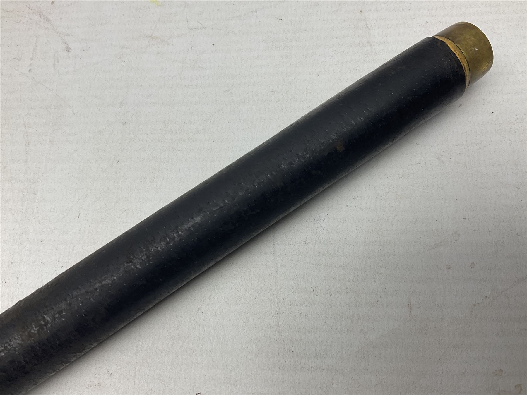 Early 20th century British Army Officer’s leather covered swagger / sword stick by Swaine & Adeney of 185 Piccadilly London; 34.5cm double edged spear point blade with etched foliate decoration and retailer’s details; stamped 'Forged in London' to the edge of the ricasso; L59.5cm overall