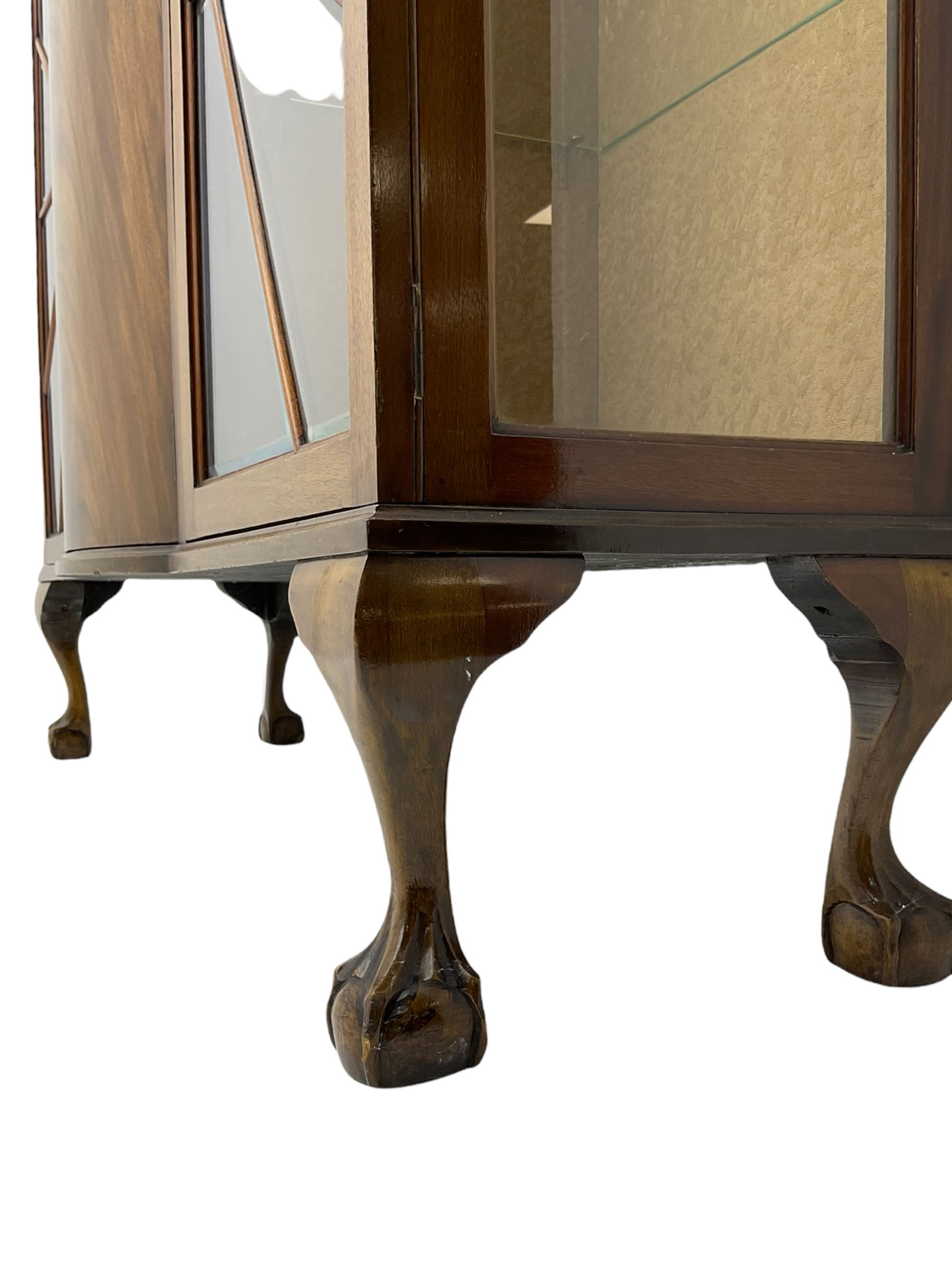 Mid-20th century Art Deco style walnut display cabinet, two central drawers over cupboard flanked by two bevel glazed display cabinets with sunburst astragal glazing, on ball and claw cabriole feet