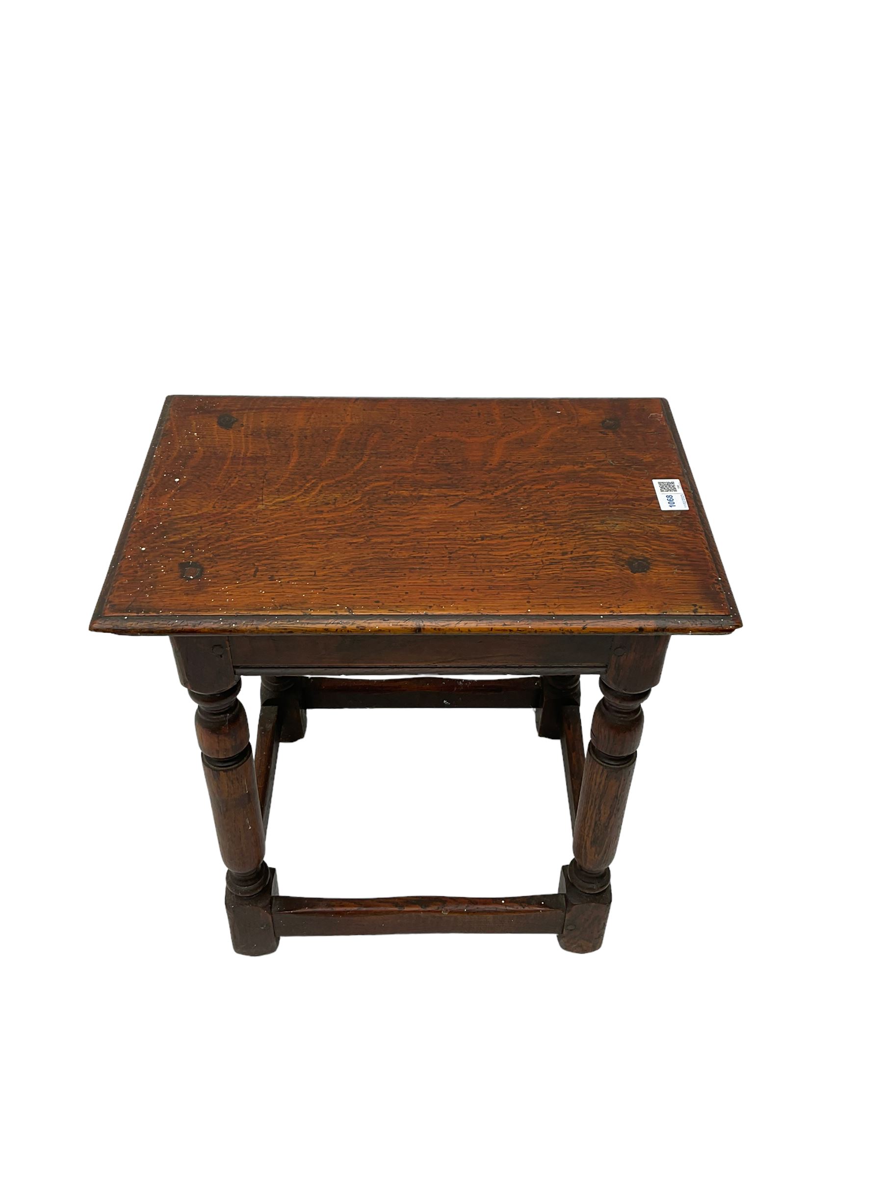 Oak coffin or joint stool, rectangular top with shaped edge over splayed turned supports with stretcher base 