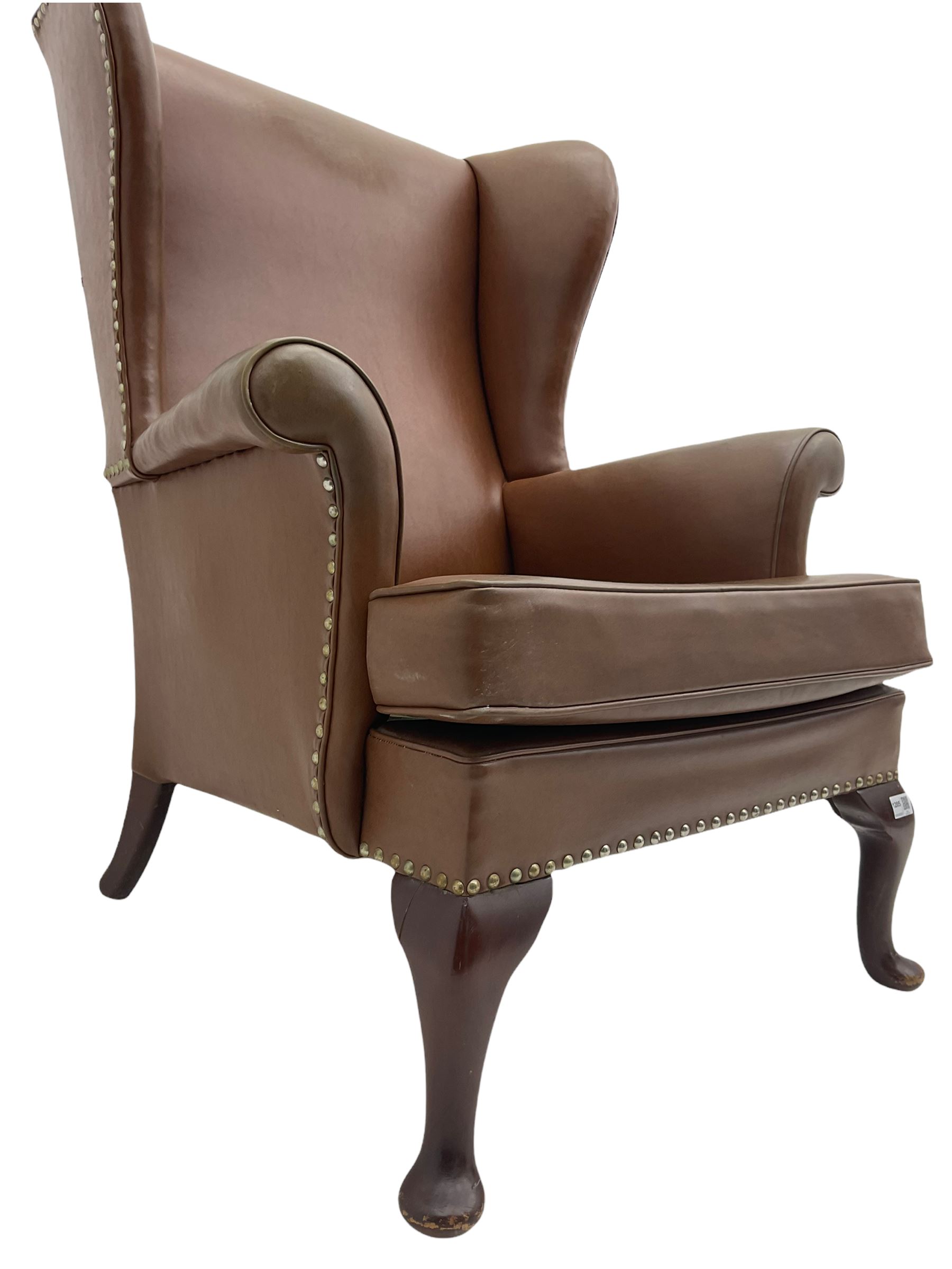Parker Knoll mid20th century wing back armchair, upholstered in Rexine type cover The