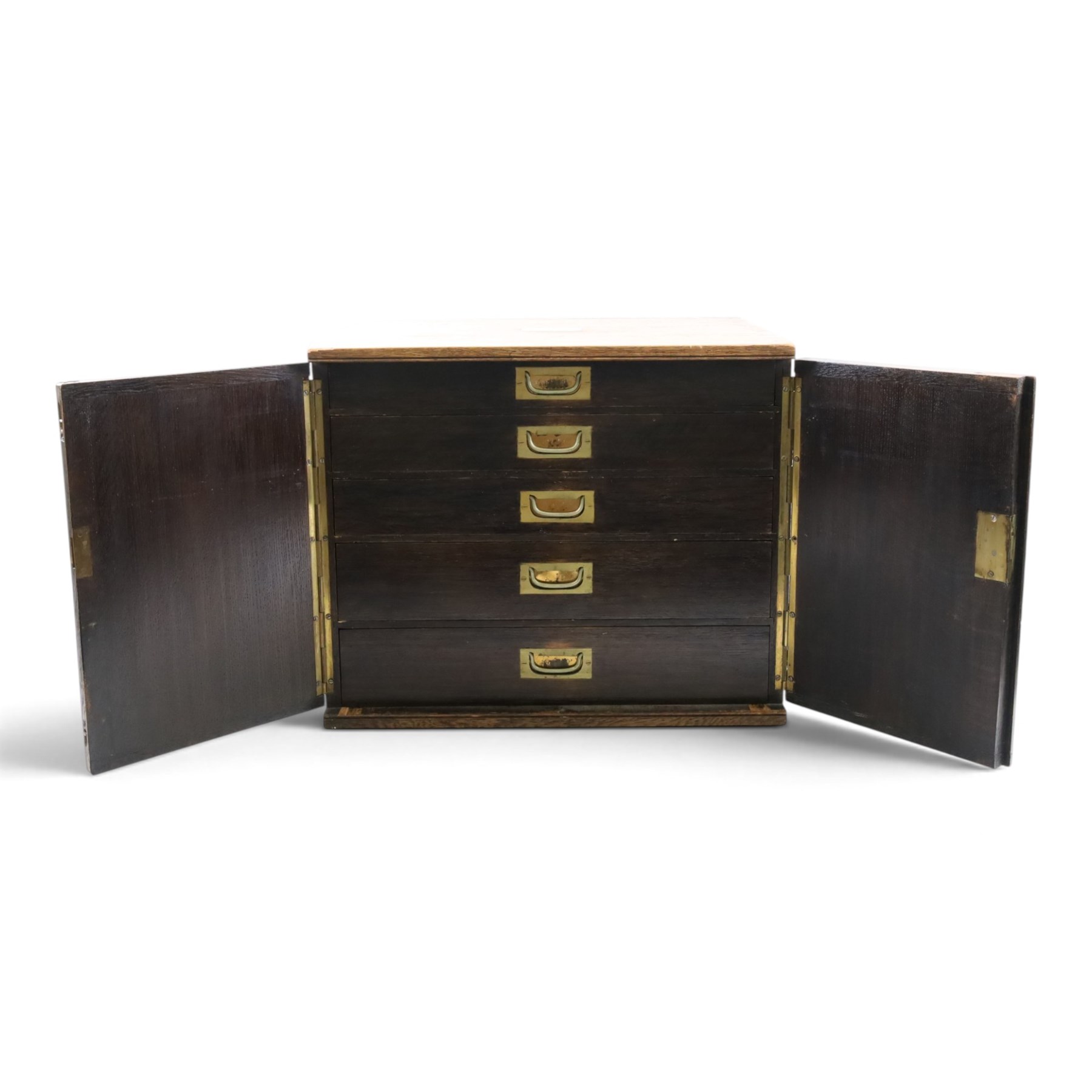 Ealy 20th century oak canteen, with five drawers behind double doors, four drawers containing a part set of silver plated Hanoverian pattern cutlery with engraved monograms and a set of twelve mother of pearl handled fruit knives and forks, the last drawer containing a collection of loose silver plated cutlery, canteen H39cm, W48cm