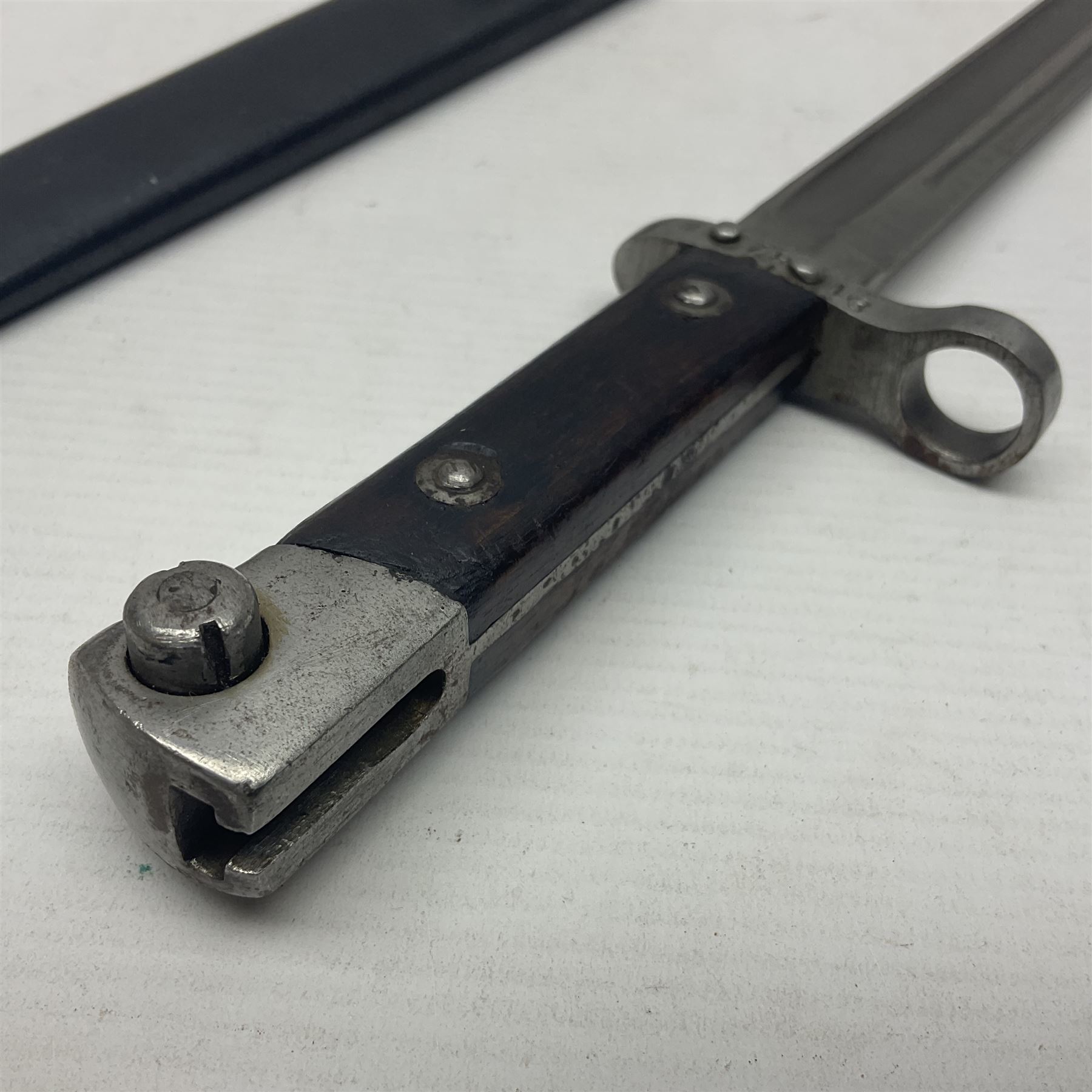 Austrian Model 1895 Carbine knife bayonet with 24.5cm fullered steel blade; various marks to the ricasso including F.G. GY.; cross-piece marked No.7843; in steel scabbard L37cm overall