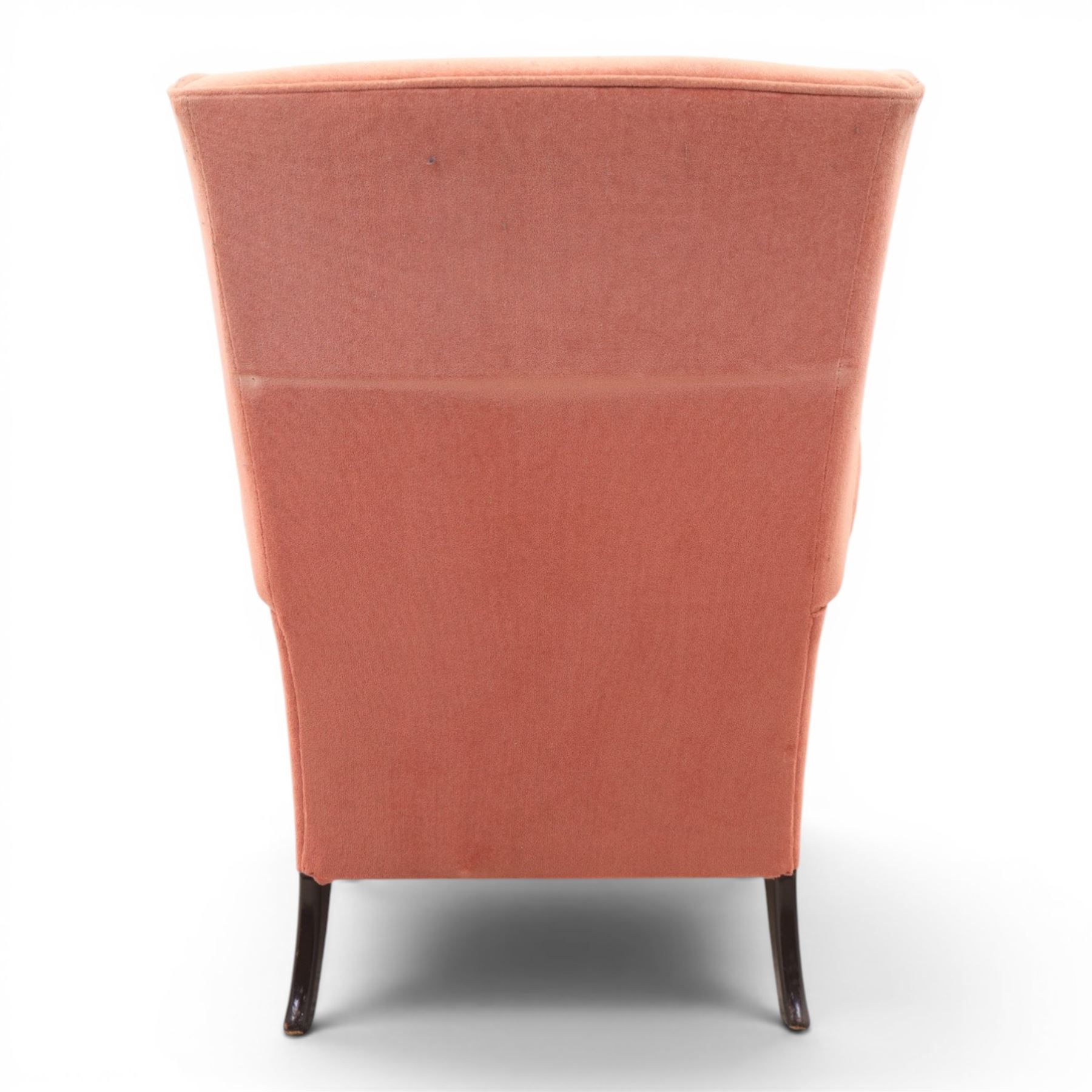 Parker Knoll - mid-century armchair suite, 'Model N30' recliner armchair with headrest and deep buttoned seat and back raised on castors, a wide armchair with deep button back and seat raised on castors, a wingback chair with flared scrolled arms, raised on cabriole supports