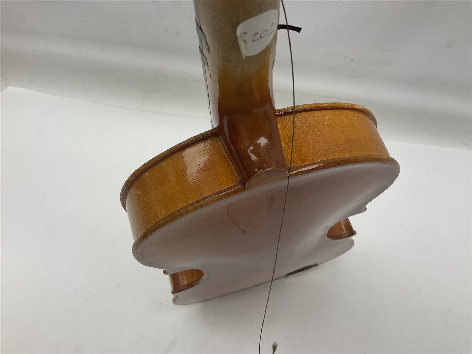 Four Chinese graduated violins - full size with 35.5cm two-piece back; three-quarter size with 33.5cm two-piece back; half size with 31cm two-piece back; and quarter size with 27.5cm two-piece back; all cased except full size; one with bow (4)