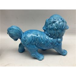 Two Chinese blue glazed Fo Dogs, and a Chinese silver-wirework inlaid figure, largest L35cm (3)