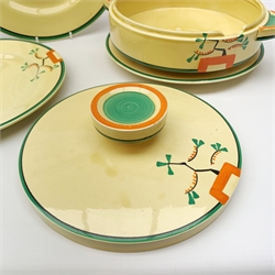 A Clarice Cliff Bizarre by Wilkinson/Newport Pottery vegetable tureen and cover, dinner plate and two dessert plates in the Ravel pattern. (4).
