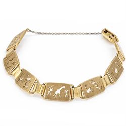Gold seven panel bracelet, each with pierced design hunting scene decoration, stamped 9ct