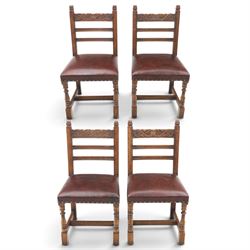 Craftsman made set of four solid oak dining chairs with leather seats, with carved crestin...
