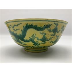 Pair of Chinese famille jaune bowls, decorated in green enamel with a dragon chasing a flaming pearl amongst clouds, upon a yellow ground, the interior decorated to centre with dragon, with six character mark beneath, D17.5cm