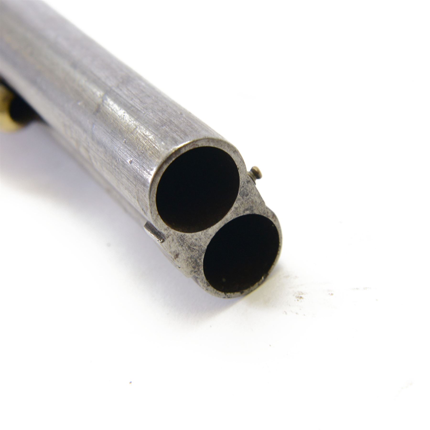 19th century double-barrelled percussion pistol the side by side barrels engraved with Arabic script, engraved with floral motifs, chequered wooden grip with engraved brass butt cap, L37CM