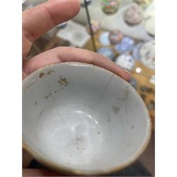 Group of eight 18th century and later Chinese famille rose and similar painted teabowls and dishes, to include unmarked peony cup, small cup decorated with flowers and butterfly, cup decorated with female figure gazing out of a window in a Buddhist temple with indistinct square character mark to base, pair of saucers unmarked, and others with character scenes unmarked (8)