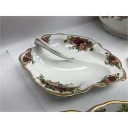 Royal Albert Old Country Roses pattern part tea and dinner service, to include two tureens, eight dinner plates, six side plates, twelve bowls, two mugs, seven teacups and saucers, milk jug,  twelve cake plates, six soup bowls and saucers, candlesticks, etc (95)