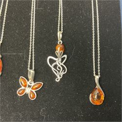 Seven silver Baltic amber pendant necklaces, including octopus and butterfly designs, all stamped 925 