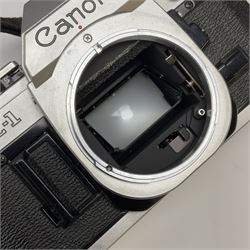 Canon AE1 camera, 'no. 4403757', fitted with Canon 'FD 50mm 1:1.8' lens, Hoya 'HMC Wide-Auto f24mm 1:2.8' lens and various other lenses and camera accessories, housed in a soft carry bag