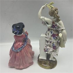 Pair of Capodimonte figures, a young girl picking grapes, and a boy warming hands on a fire, together two Royal Worcester figures, Feeding Henrietta and Pick of the litter and five other figures 