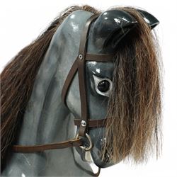 Wooden rocking horse, in Dapple Grey paint finish with reins and stirrups, on pine trestle base, metal plaque inscribed 'Hoppringle Horses by J. J.V. Eyre Hoppringle by Stow, Galashiels TD1 2TJ'