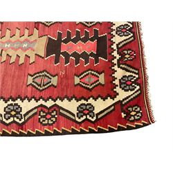 Large  red ground Kilim rug or wall hanging, decorated with geometric patterns and dated within the weave '1969'