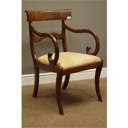  19th century mahogany Recency style armchair, curved figured top rail above carved horizontal rail, down swept scrolled arms. upholstered drop in seat, sabre supports, W53cm  