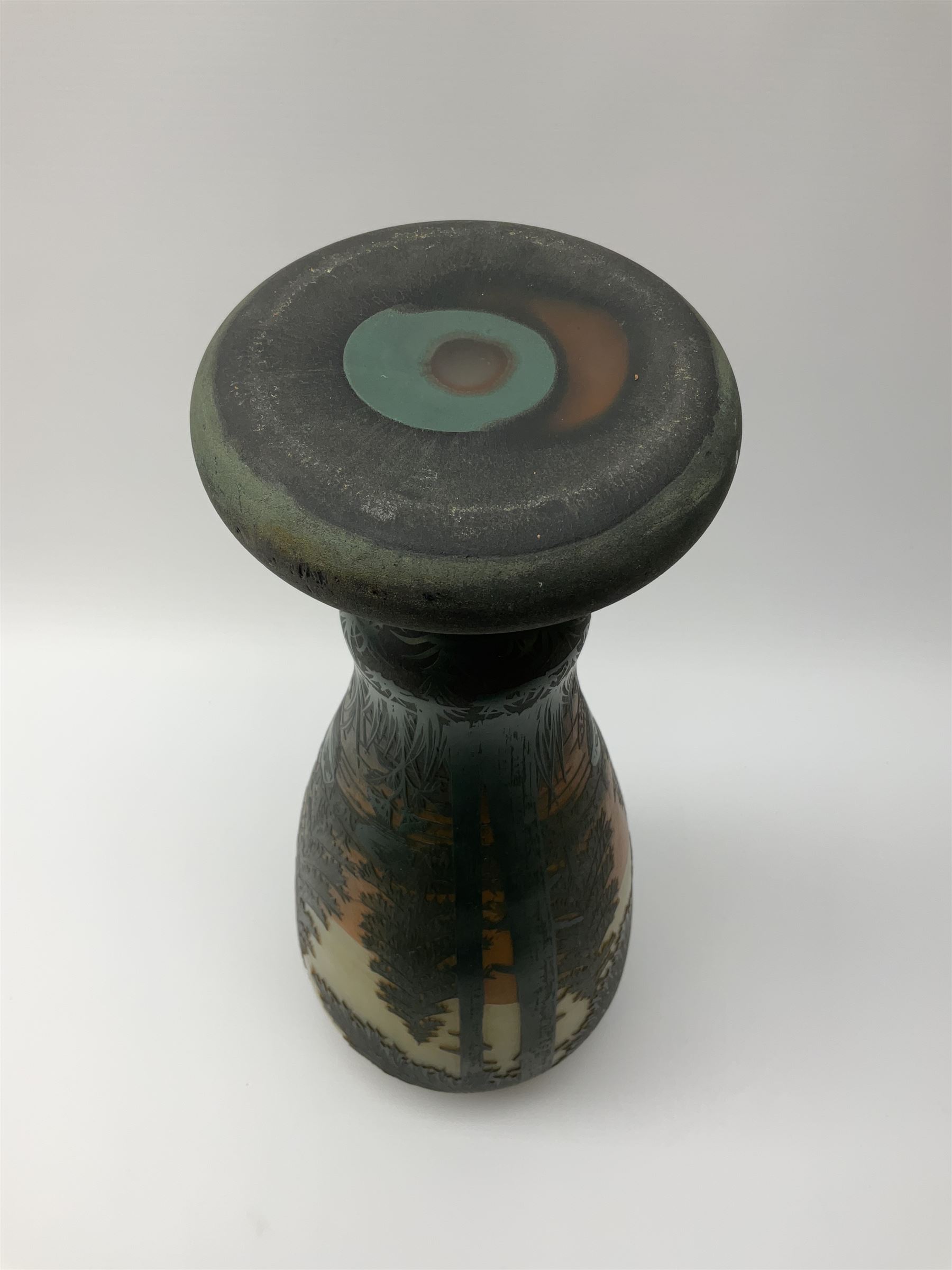 Reproduction Daum Nancy art nouveau  style overlay and cut glass vase in ovoid form with a circular base, decorated with woodland and mountain scene, H38.5cm. 