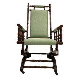 Early 20th century walnut framed American rocking chair, upholstered seat, back and arms