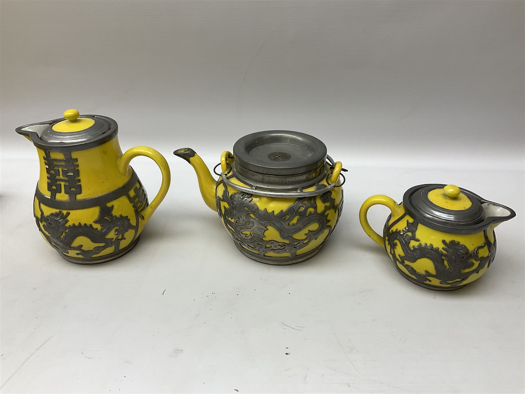 Chinese Hor Chung Wei Hai Wei tea set five pieces, bound by figurative pewter upon a decoration tray