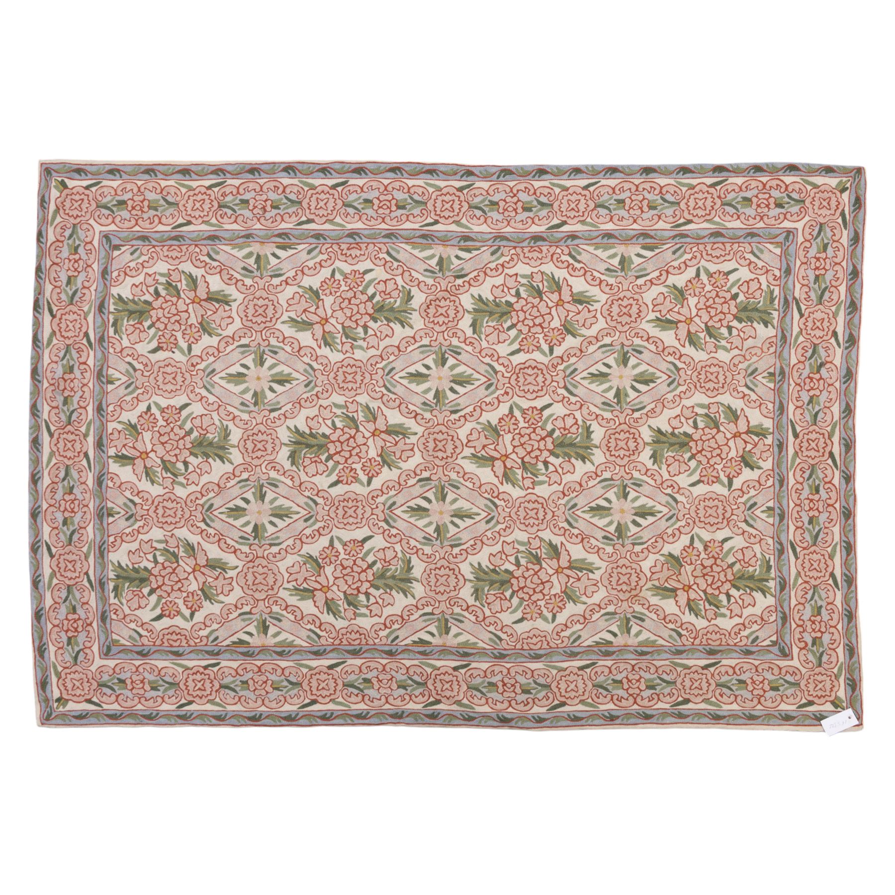 Kashmiri chain stitch crewel embroidered wall hanging, wool on cotton ground, decorated with an all-over lattice of floral medallions and stylized foliage with multiple floral borders 