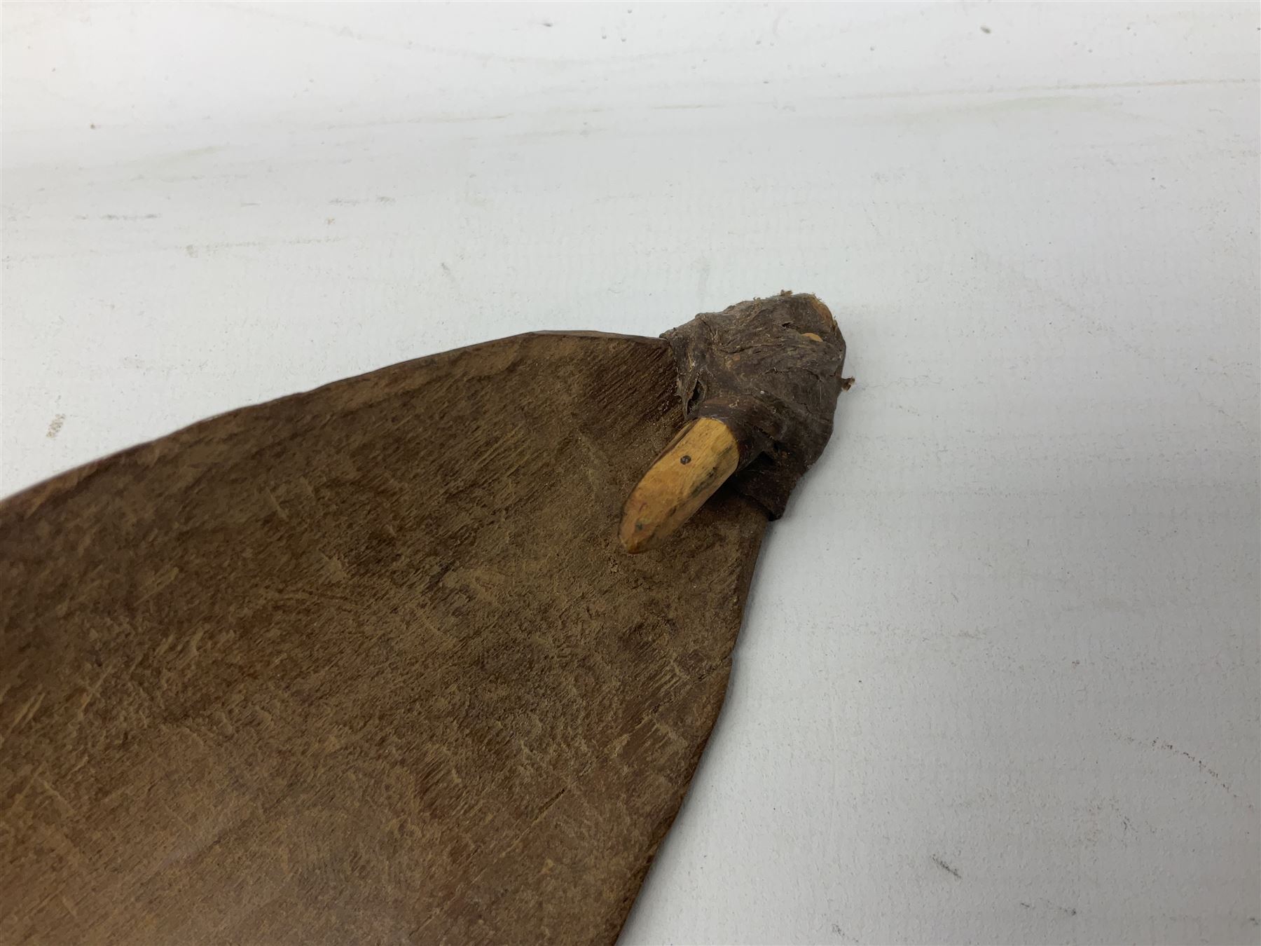 Australian Aboriginal shield, carved with Kangaroo and Emu, 74.5cm; Spear painted with aquatic creatures 78cm, and Spear thrower 81cm (3)