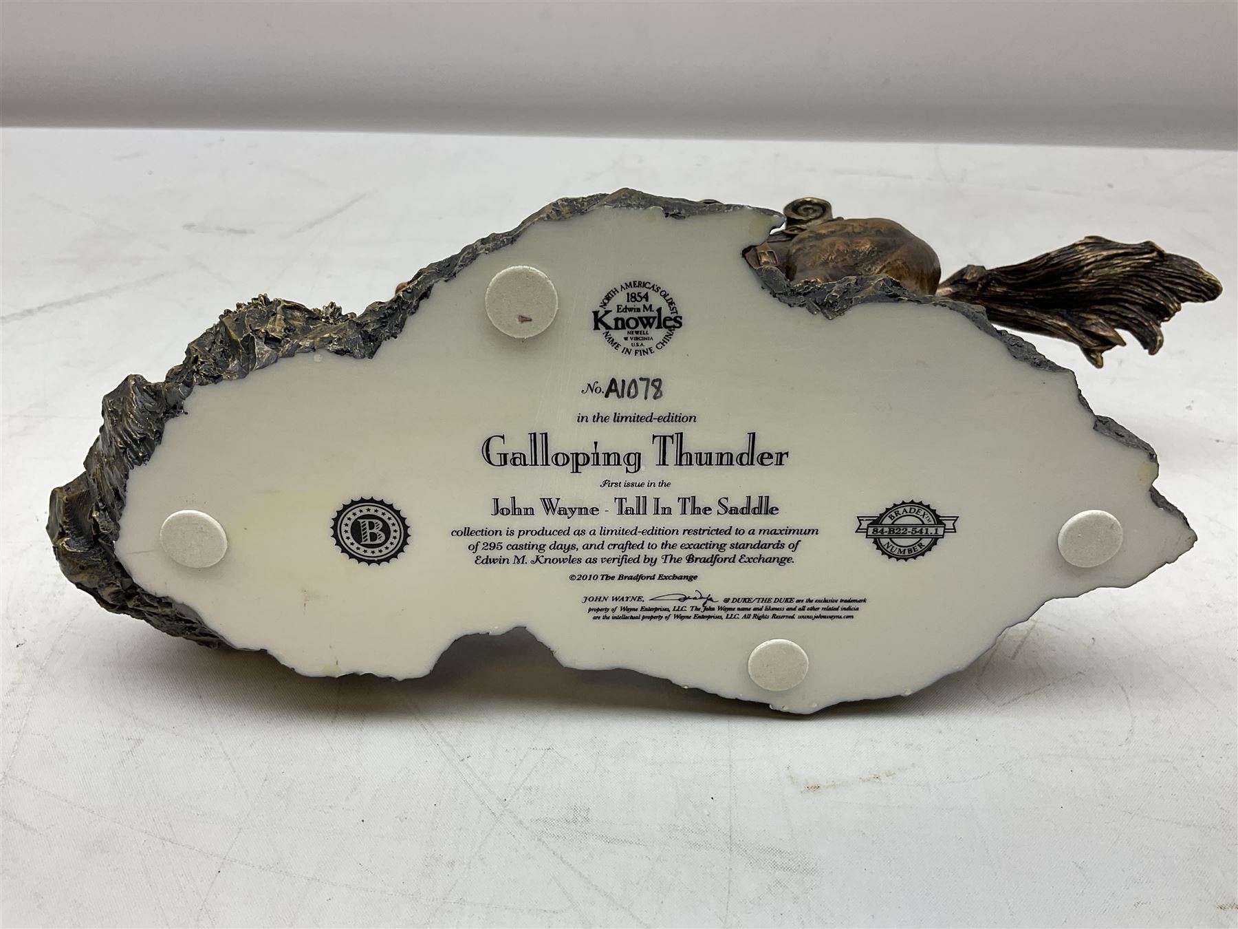 The Bradford Exchange John Wayne bowie decorative knife, L27cm and John Wayne Tall in the Saddle Galloping Thunder figure group