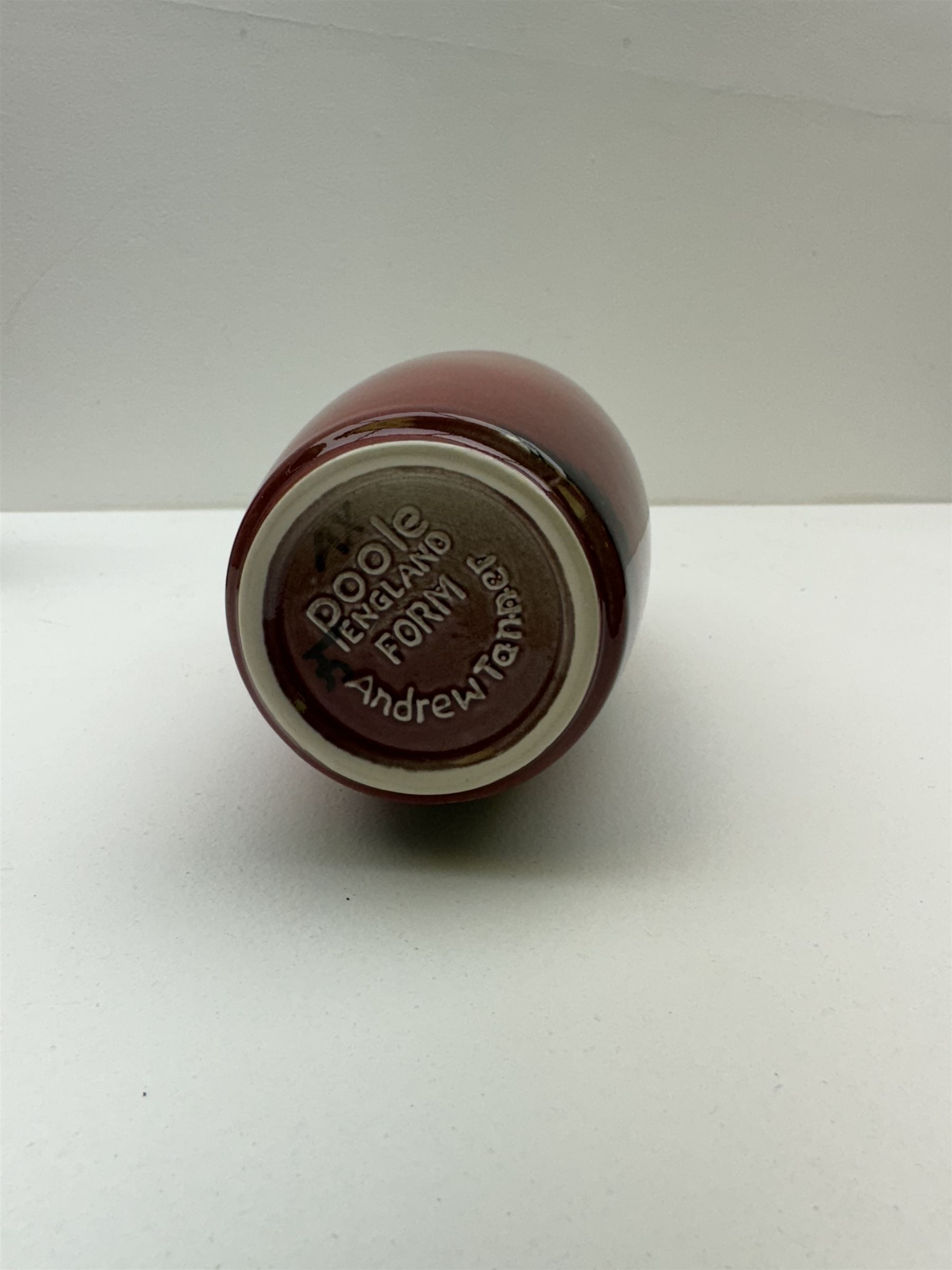 Poole pottery Form vase by Andrew Tanner, decorated with a silhouette of a tree beneath a red sun, together another with Poole pottery vase and dolphin, largest H24cm 