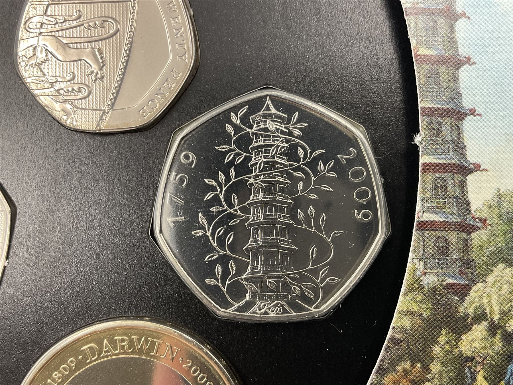 The Royal Mint United Kingdom 2009 brilliant uncirculated coin collection, including Kew Gardens fifty pence, in card folder