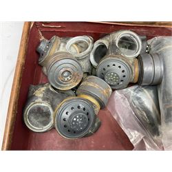 Early 20th century leather suitcase marked to the top 'Major P.M. Newton R.E. Crossways, Bridlington, East Yorkshire' 60 x 40cm; another similar leather suitcase marked W.D. to the lid; three post-WW2 respirators; and three unopened pairs of British Army N.B.C. (Nuclear Biological Chemical) No.1 Mk.III Trousers Protective (8)