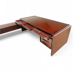 Dyrlund - contemporary Santos rosewood executive desk set, main desk with a rectangular top and leather writing pad above, floating drawer unit with right-angled desk unit top with document tray above a filing drawer 

Note: Dyrlund is a Danish furniture manufacturer known for its high-quality, handcrafted pieces, particularly in the mid-century modern style. Founded in 1960 by Frits Hjerte Dyrlund in Rude, Denmark, the company has remained a family business, now run by the second and third generations. Dyrlund specializes in both home and executive office furniture, focusing on practicality, solid construction, and classic design