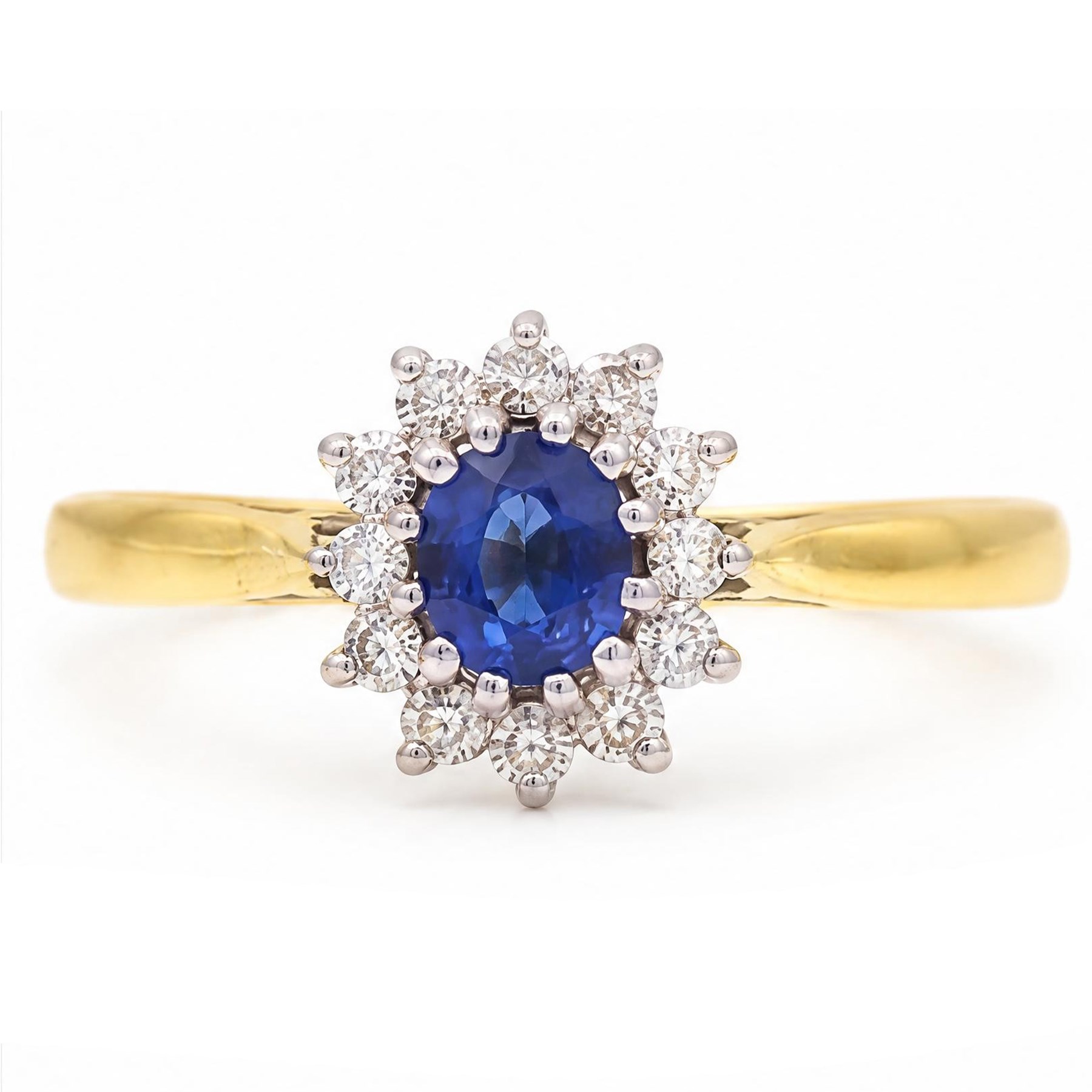 18ct gold sapphire and diamond cluster ring, single oval cut sapphire of approx 0.45 carat, surrounded by twelve round brilliant cut diamonds, London 1998, total diamond weight approx 0.25 carat