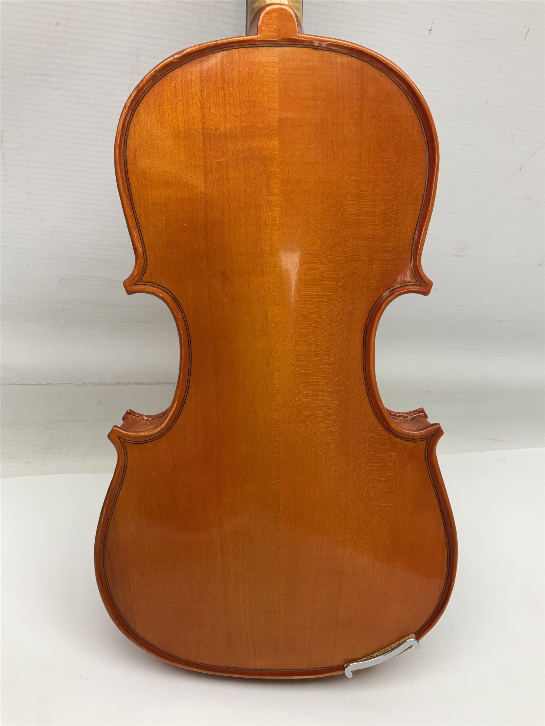 Three Stentor Student violins - three-quarter size with 33cm two-piece back; and two quarter size each with 28cm two-piece back; each in carrying case with bow (3)