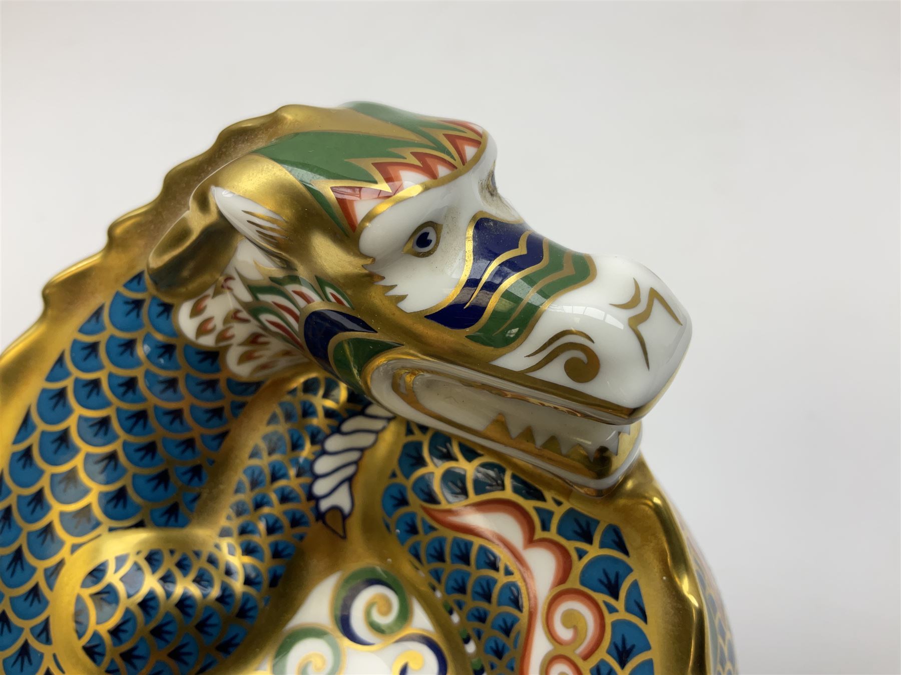 Two Royal Crown Derby paperweights, Dragon of Happiness, limited edition 1227/1500 and Dragon of Good Fortune, limited edition 1227/1500, both with gold stopper, hardwood base, certificate and with printed mark beneath