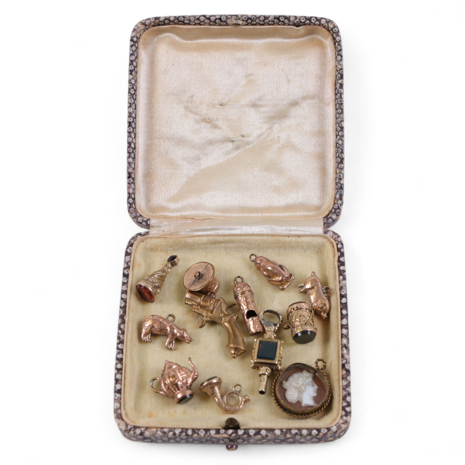 Collection of gold plated charms, including teapot, monkey, cameo etc